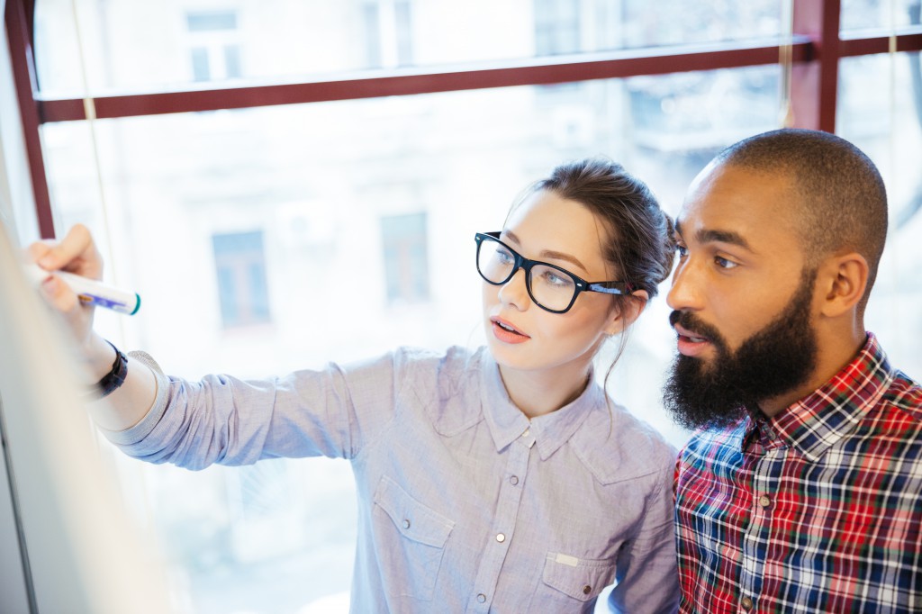 Business people working with whiteboard